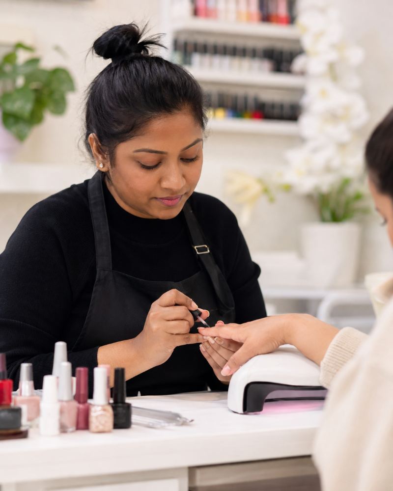Nail professional working in a nail studio